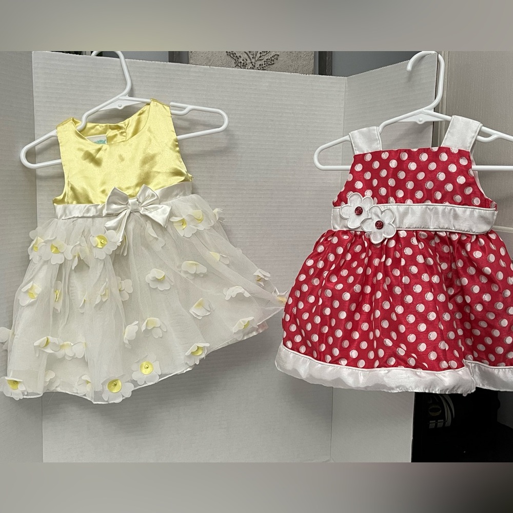 Pair of designer baby girl dresses. Size 6-9M